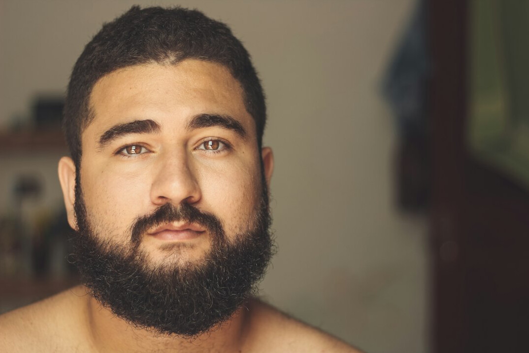 Studio portrait of a Uruguayan man writer with a beard